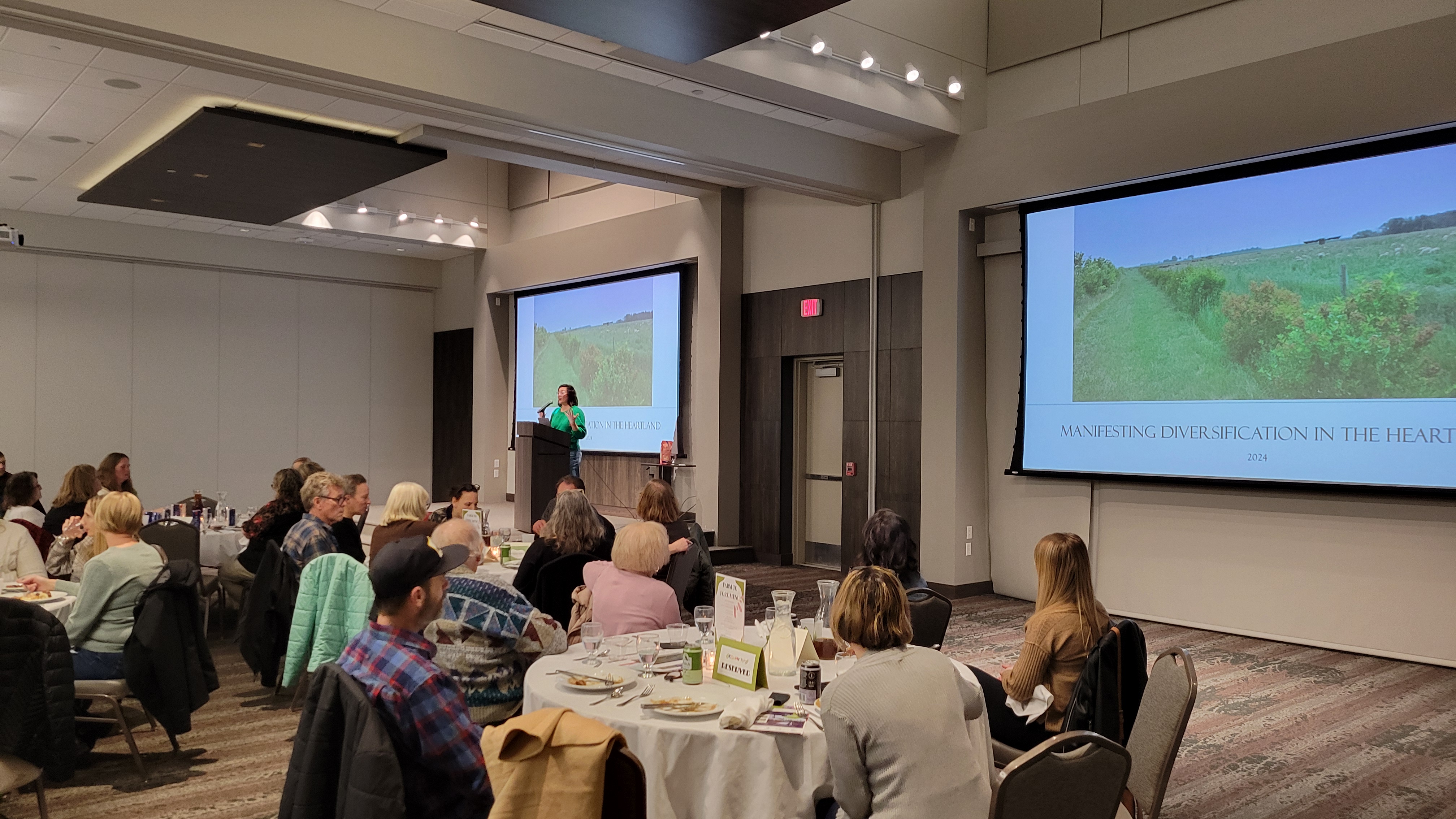 Farm to fork dinner 2024 participants listening to the keynote speaker over dinner