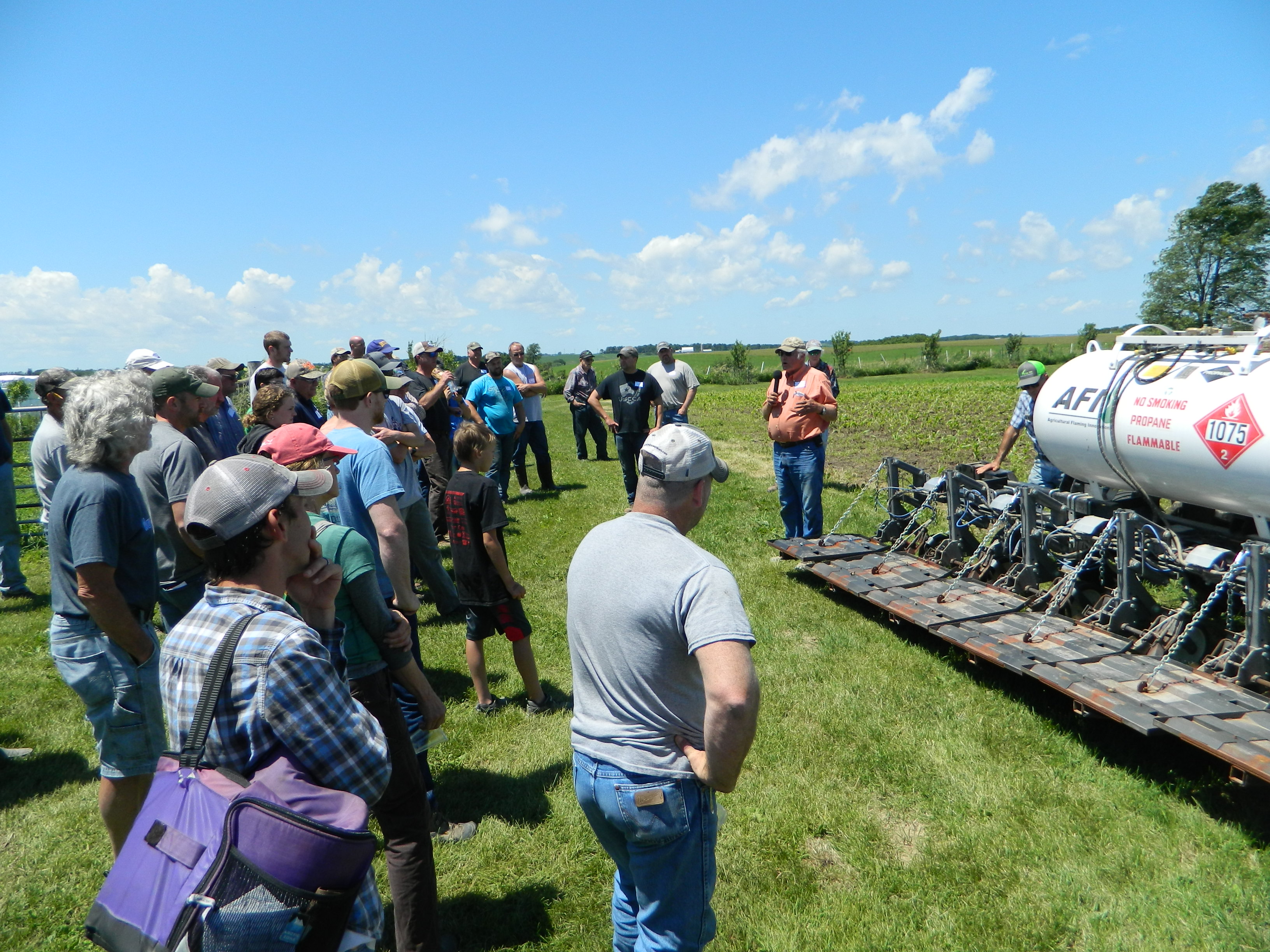 Farmer presenting outside at a farmer field day